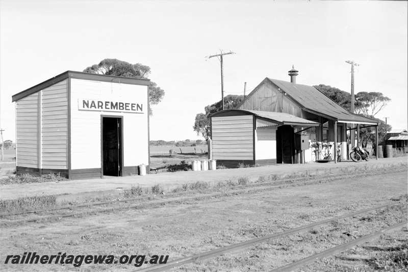 P21608
Station buildings, station nameboard, platform, tracks, Narembeen, NKM line, view from track level 
