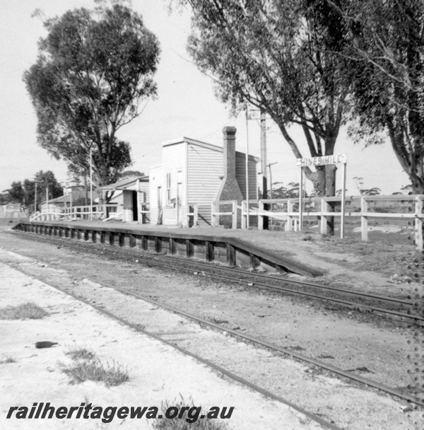 P21832
Platform, station buildings with brick chimney, station nameboard, tracks, Hines Hill, EGR line, view from track level
