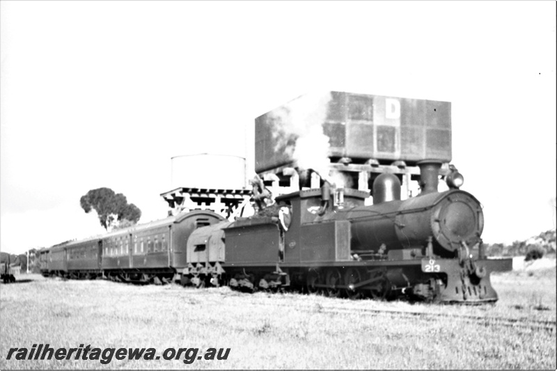 P21921
O class 213, on inspection train, two adjacent water towers, one with a 25,000 gallon cast iron tank and the other with a cylindrical corrugated iron tank, Kwobrup, KP line, side and front view
