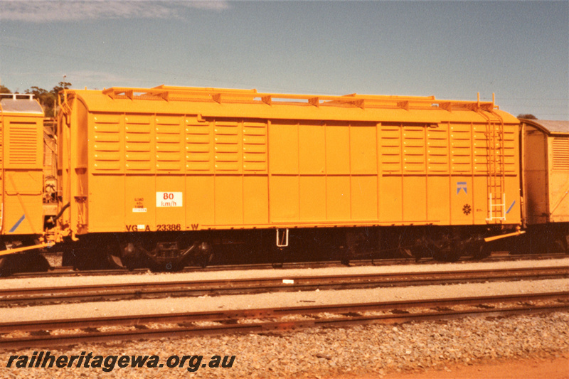P21954
VGA class 23386 bogie grain wagon modified from a VG class bogie van, yellow livery, Avon Yard, mainly a side view

