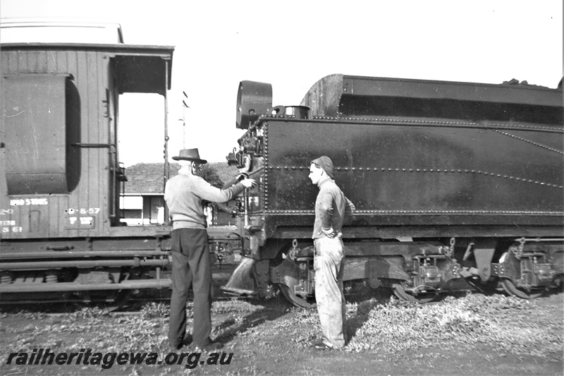P22335
Fs class locomotive ,rear half of tender, shows rear headlight and cowcatcher,  part view of a brakevan with clerestory roof, side view  East Perth. ER line.
