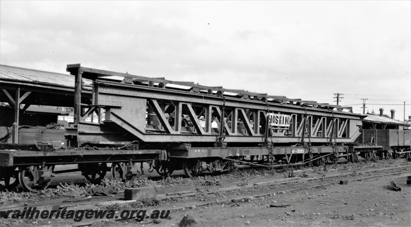 P22361
QA class 9393 bogie flat wagon loaded with over length crane traverser with 