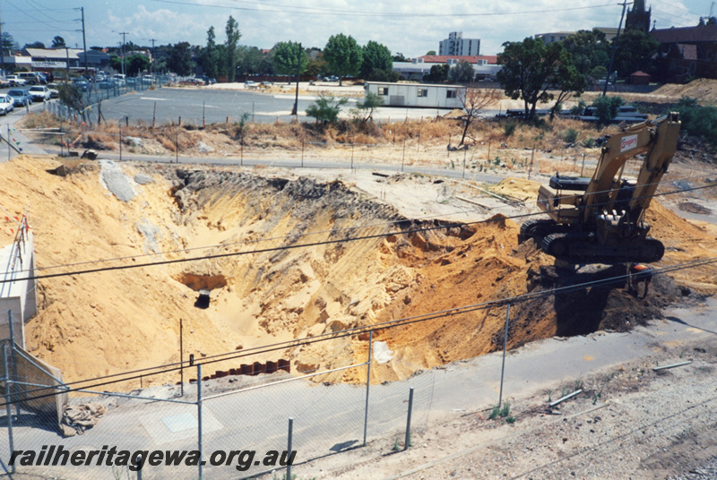 P22413
Site works, mechanical digger, demountable building, Subiaco Centro project, overview from elevated position
