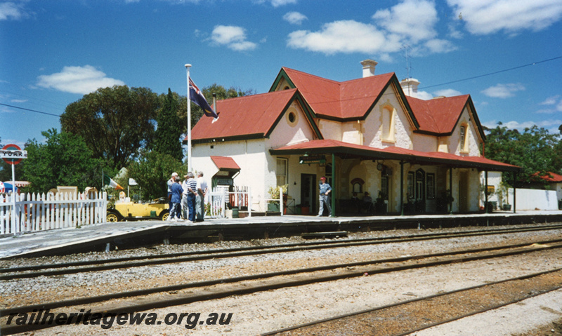P22455
Station building, platform, canopy, station nameboard, flagpole, pedestrians, tracks, York, GSR line, view from track level
