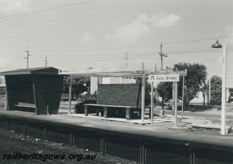 P22476
Oats Street station SWR line 4 of 5, platform, shelters, station nameboard, station light, view from opposite platform, c1976-1977
