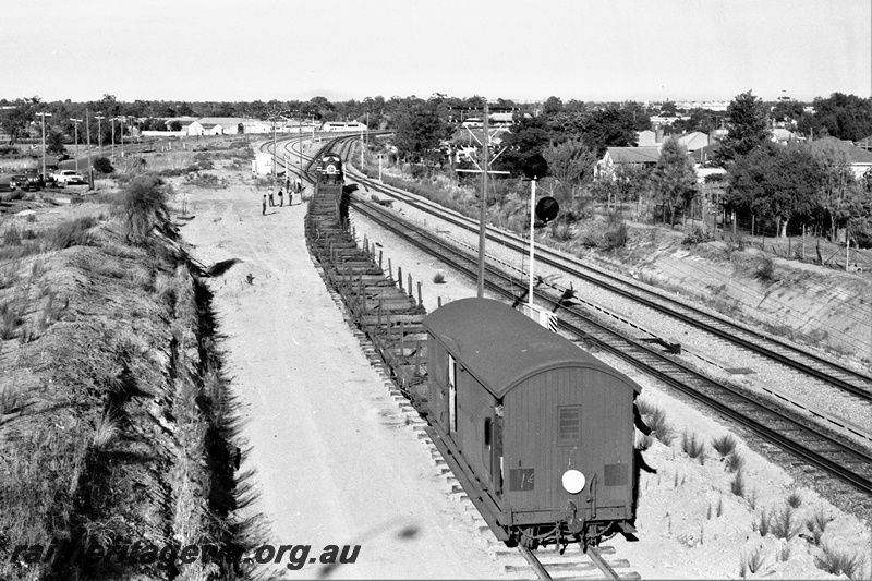 P22494
Rail reclamation on the ER 1 of 10, F class 43 pushing rail recovery train onto old Eastern Railway, signals, Bellevue, ER line, view along the train from elevated position

