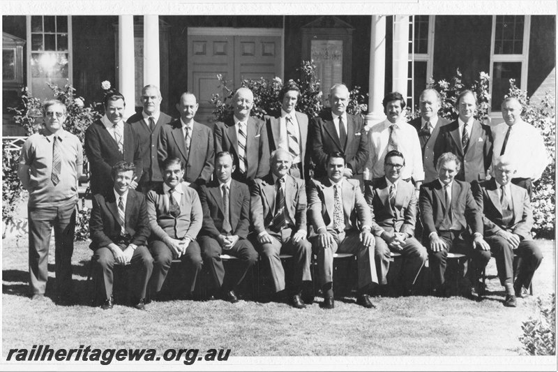 P22840
Group photo, Management Officers Westrail Workshops Midland. Back row: R. Innes (F'man elect shop), C. Gallop (F'man boilermaker), E. Mildern (F'man turner), R. Butson (F'man R/S timber), W. Trembath (F'man diesel shop), R. Littlely (Works eng'r-car), G. Galvin (F'man painter), G. Williams (F'man coppersmith), B. Woods (F'man woodmill), R. Wadham (Works eng'r-loco), N. Bell (F'man w/shops yard). Front row seated: K. Jackson (F'man patternmaker), W. Vidler (F'man toolmaker), W. Maxwell (F'man fitter), E. Arblaster (Acme-works), N. Catchpole (F'man R/S metal), D. Stuart (F'man blacksmith), G. Bailey (F'man moulder), W. Massey (F'man track equip't). 
