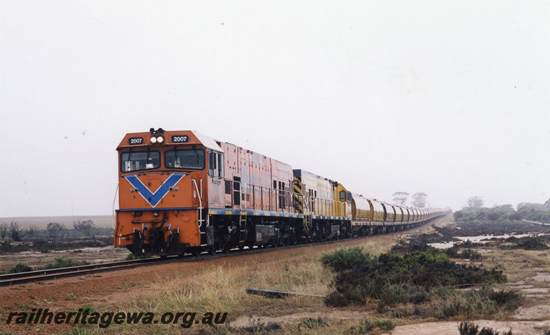 P22853
P class 2007, another diesel loco, double heading goods train, outback setting, front and side view from trackside 
