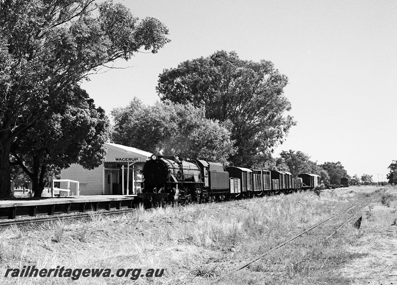 P23042
V class loco on goods train, platform, station building, tracks, trees, Wagerup, SWR line, front and side view
