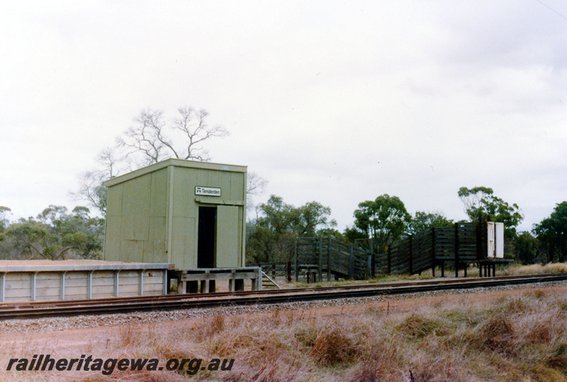P23058
Platform, station shed with sign, stock loading ramps, track, Tenterden, GSR line, trackside view 
