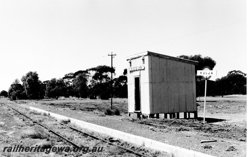 P23074
Station shed with nameboard, station nameboard, track,  Kulja, KBR line, trackside view
