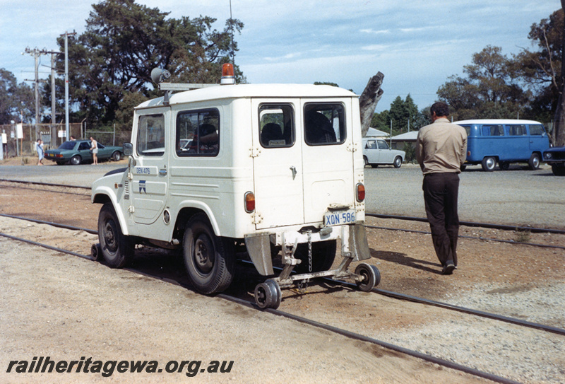 P23090
Westrail road & rail SUV type motor vehicle, displaying numbers DEN 476 and XON586, Steamfest 1988, side and rear view from trackside
