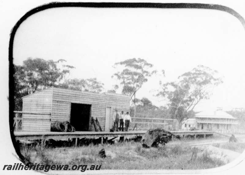 P23092
Station building, 3 men standing on platform, hotel, trees in background, Spencer's Brook, GSR line
