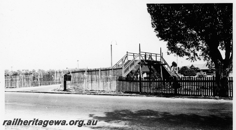 P23119
Pedestrian footbridge, picket fence, large tree, Daglish, ER line
