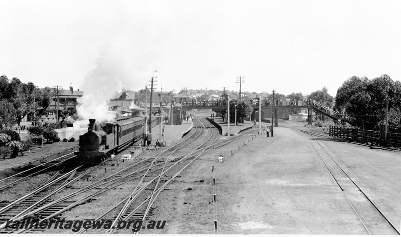 P23136
Steam hauled Royal Show train departing, platforms, station buildings, signals, onlookers, scissors crossover, tracks, Claremont, ER line, front and side view from elevated position

