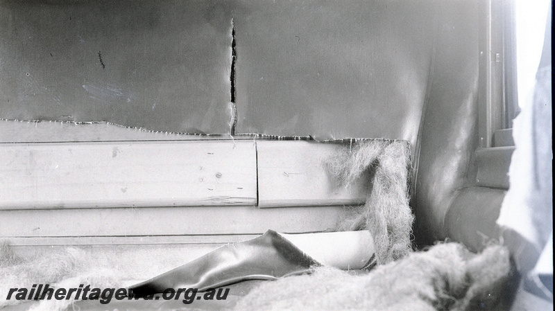 P23156
2 of 2 views of AF class 133 carriage, damage to  carriage seats during wartime, close up view
