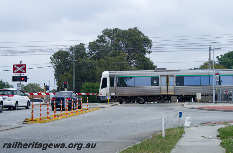 P23177
A series EMU set 4, level crossing, Hamilton Street, Queens Park, SWR line, side view 
