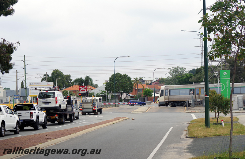P23196
A series EMU railcar, level crossing, cars banked up, Oats Street SWR line, side view
