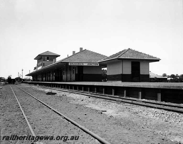 P23342
Station buildings, nameboard, signal box, view  looking north along the platform,  Brunswick Junction, SWR line. 
