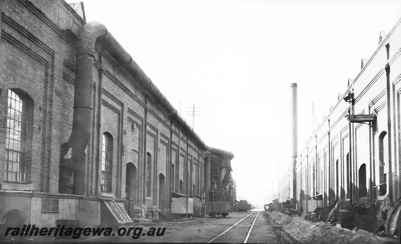P23620
Track between workshop buildings, smokestack, Midland, ER line, view from ground level
