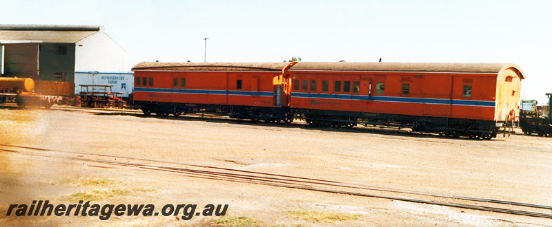 P23643
VW class 5083, formerly ZA class 159, and VW 5100, formerly ZA class 189, both in Westrail orange with blue and white stripe, log on flat wagon, shed, side and end view
