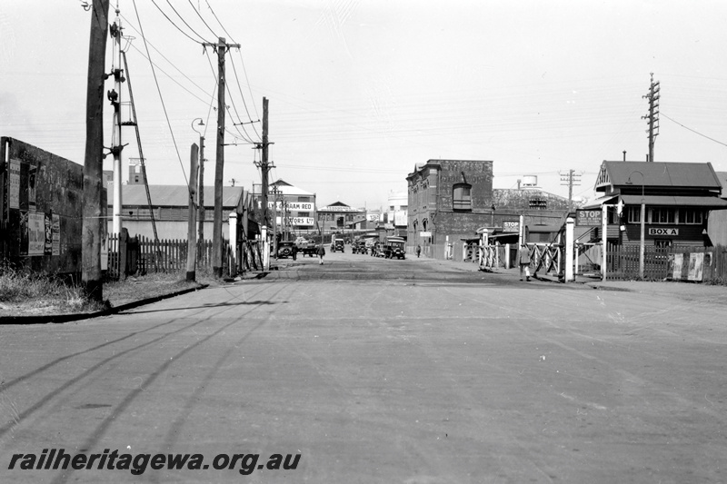 P23770
Level crossing with crossing gates, Box A signal box, Melbourne Road, west Perth, view along the road.
