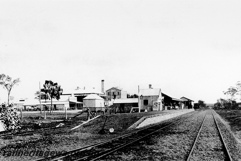 P23791
Station buildings, stone faced platform, point lever, flour mill , Katanning, GSR line, view along the line, c1903
