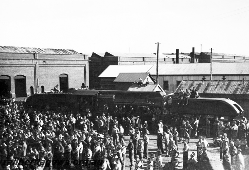 P23809
ASG class loco, at ceremony marking its handover to the Commonwealth Land Transport Board, crowd of workers, workshop buildings, Midland Workshops, ER line, elevated view
