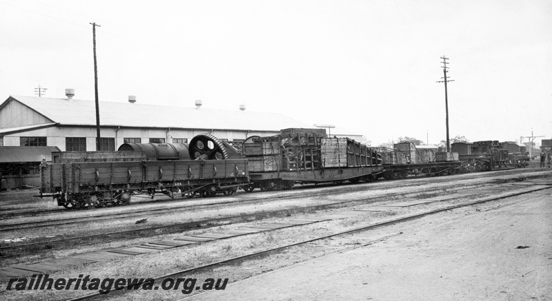 P23817
Rake of wagons comprising RB class 684, lamp, no vacuum pipe, all side doors, QAS class 9370  QM class wagon, QX class 2300 trolley wagon, trackside building, tracks, end and side view. See P23818
