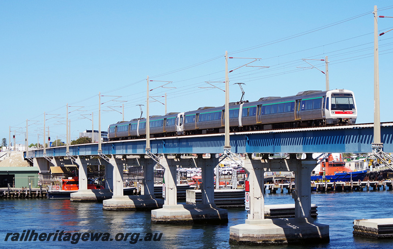 P23866
AEB class 332, AEA class 232, EMU set 32, and another A series EMU set, crossing steel and concrete bridge over Swan River, Fremantle, ER line, side and end view
