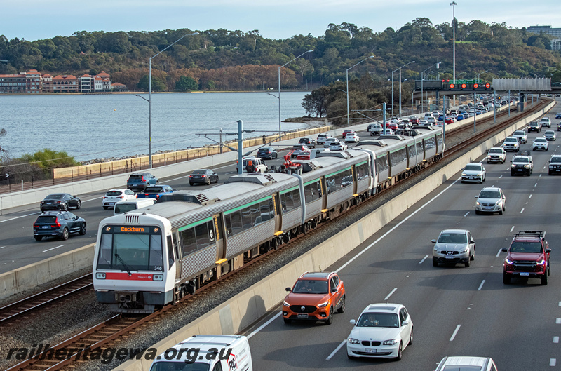 P23871
AEB class 346, AEA class 246, EMU set 46, another A series EMU set, Kwinana freeway, traffic, old Swan Brewery in background, South Perth, Joondalup line, front and side view
