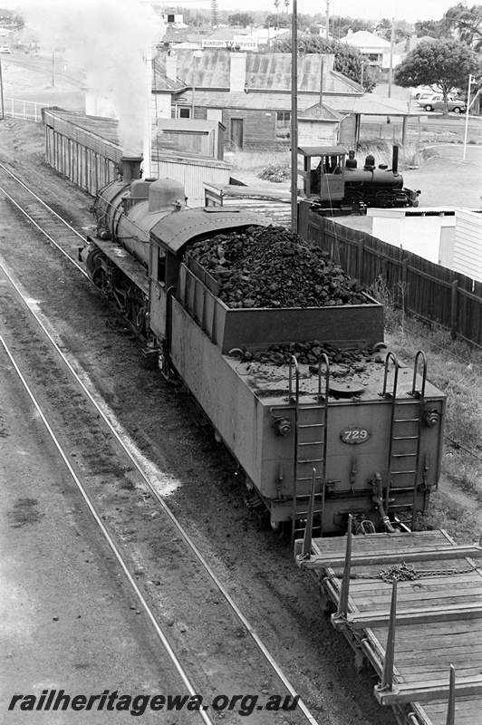 P23896
PMR class 729, flat wagon, small tank loco, trackside houses, Bunbury, SWR line, view looking down on passing loco from an elevated position, showing top of tender
