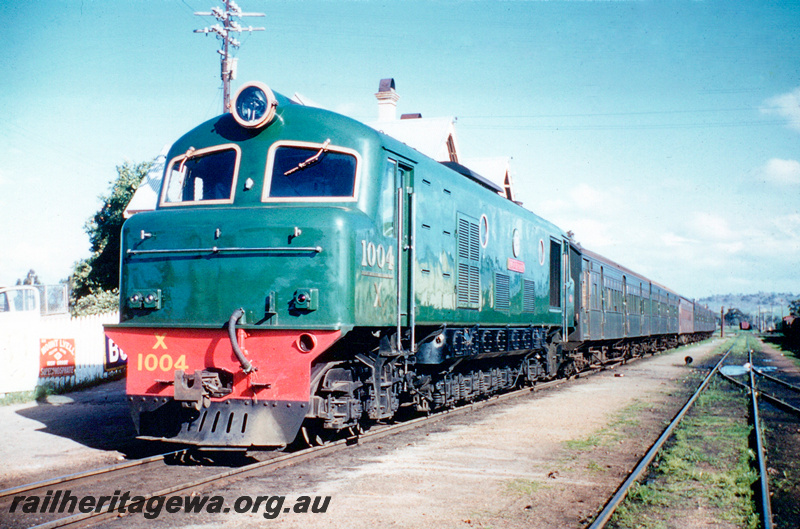 P23917
X class 1004 in the plain green livery hauling a country passenger train, York, GSR line,  front and side view

