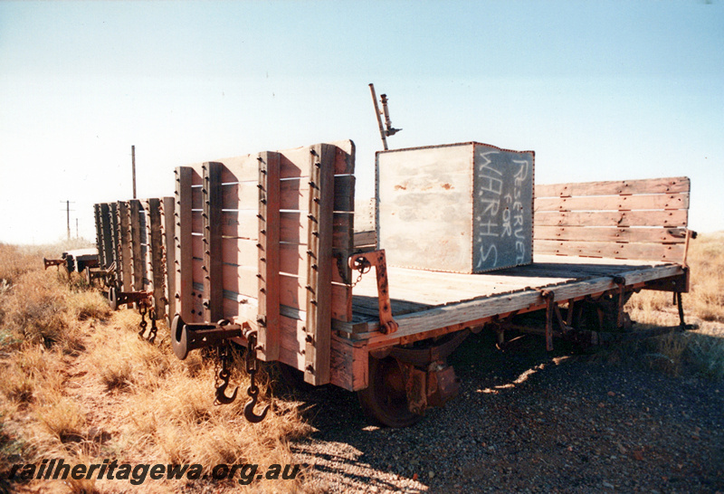 P23923
Grounded jetty wagons with low sides and high end bulkheads, Point Samson, 400 gallon tank on board with 