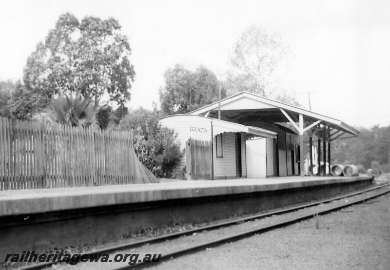 P23943
Ladies waiting room, Out Of Shed, other buildings under an overall canopy, picket fence, platform, Darlington, M line, view along the platform looking east.
