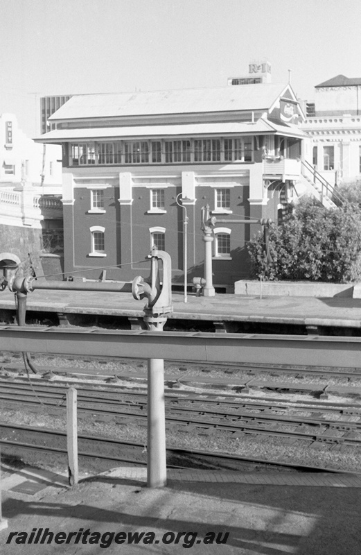 P23944
Signal box, C cabin, water cranes, platforms, city buildings, Perth station, ER line, view from opposite platform
