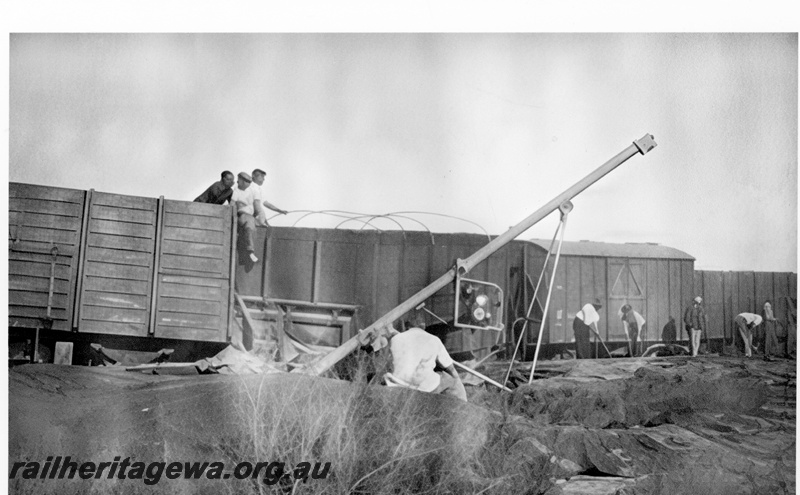 P23988
Derailment of No 60 Fast Goods near Nalkain WLB line, 1 of 7, various vans and wagons, workers, ground level view
