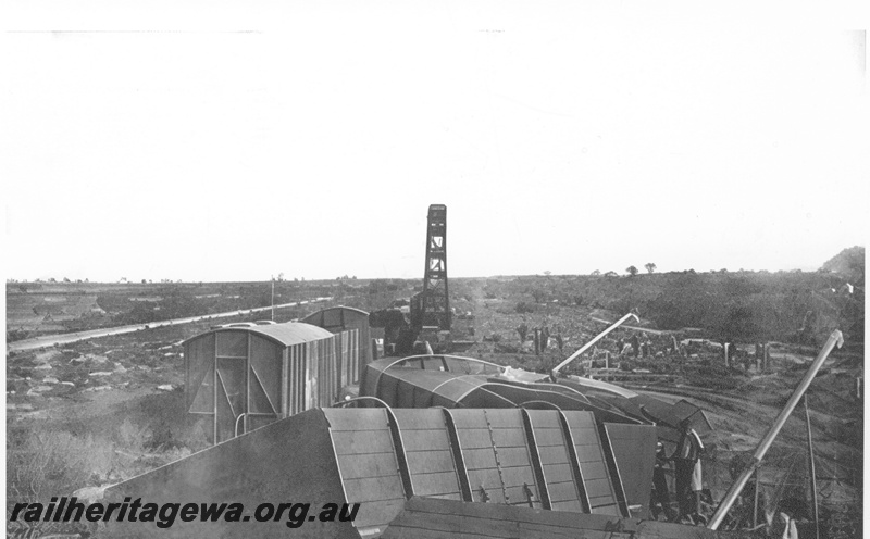 P23989
Derailment of No 60 Fast Goods near Nalkain WLB line, 2 of 7, vans and wagons off track, workers, crane, elevated view
