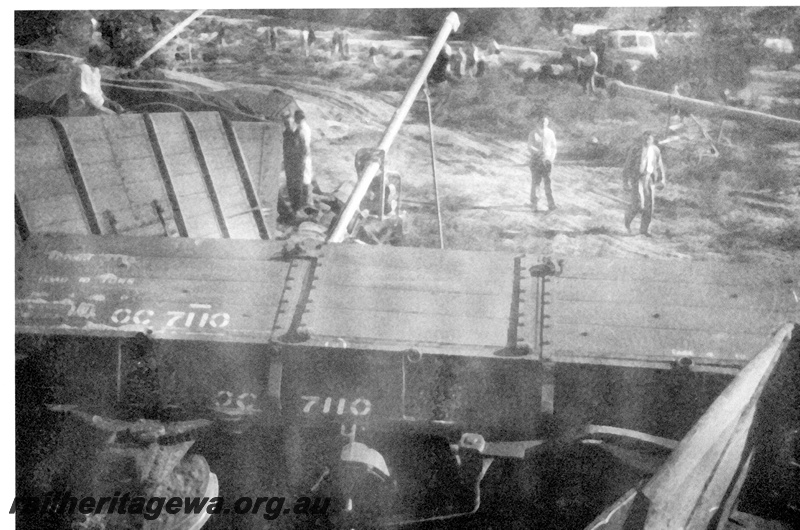 P23994
Derailment of No 60 Fast Goods near Nalkain WLB line, 7 of 7, GC class 7110 wagon, off track and on side, workers, truck, another damaged wagon, elevated view
