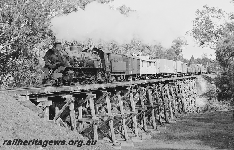 P24005
W class 902 hauling number 38 goods Busselton to Bunbury crossing Capel River wooden trestle bridge near Capel. BB line.
