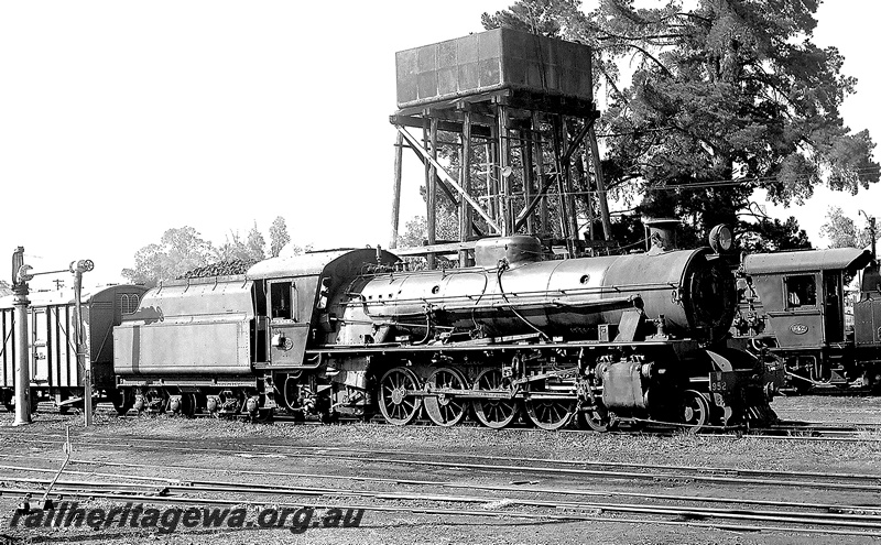 P24027
W class 952 and W class 942 cross at Donnybrook. Water tower with a 25,000 gallon cast iron tank in photo. PP line. 
