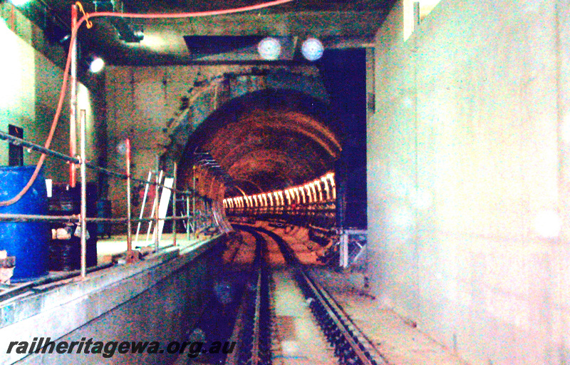 P24051
Tunnel, tracks, platform, wiring, scaffolding, William Street station, Perth underground, looking north towards Roe Street, view from track level 

