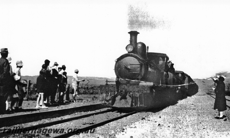 P24063
Steam hauled train, small crowd of spectators, at official opening of Denmark to Nornalup railway, D line, front and side view

