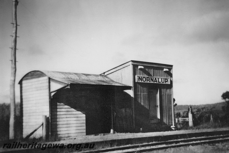 P24064
Station building, out of shed, Nornalup, D line, view across tracks 
