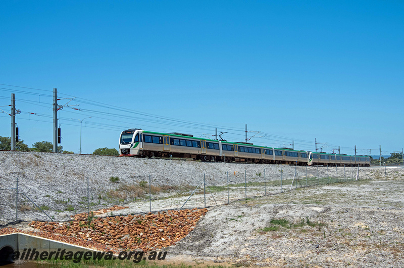 P24106
B series railcar 5053, leading B series EMU set 53, and B series EMU set 117, Whiteman Park, Ellenbrook line, front and side view
