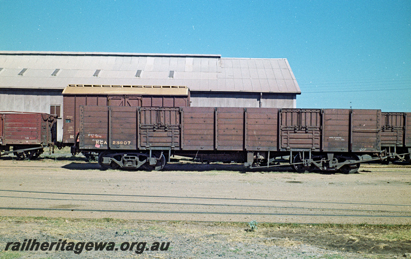 P24123
RCA class 23907 wagon, shed in background, side view
