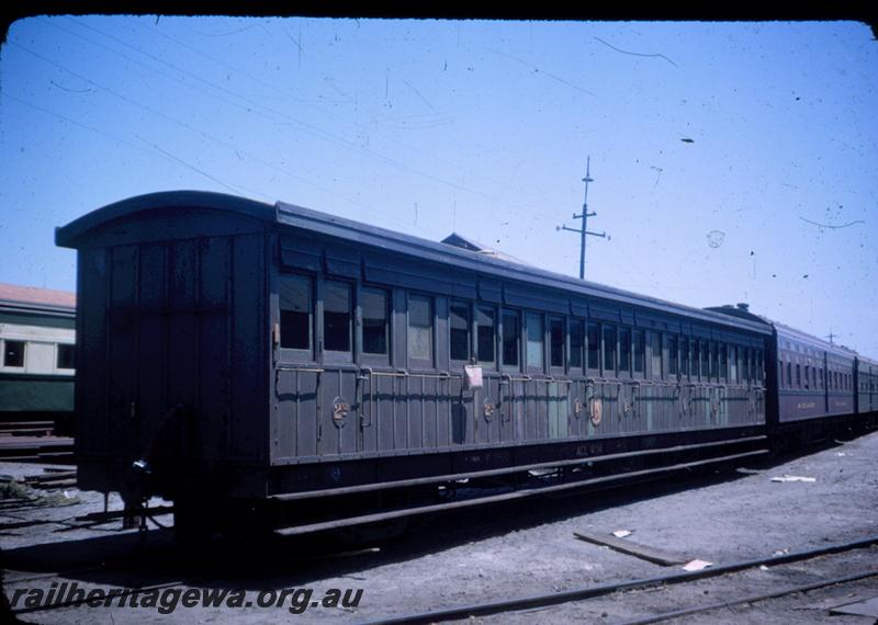 T00048
ACL class 406 carriage, green livery in poor condition, a water bag hanging outside a compartment, end and side view, a MRWA JV class carriage with blue stripe coupled behind the ACL
