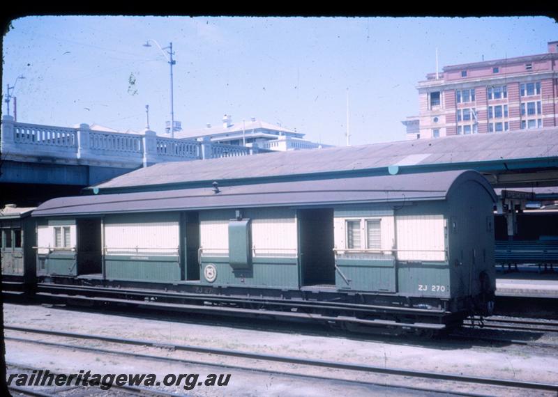 T00049
ZJ class 270 passenger brake van with the doors open, green and cream livery ,right hand facing WAGR roundel on the side, Perth, ER line
