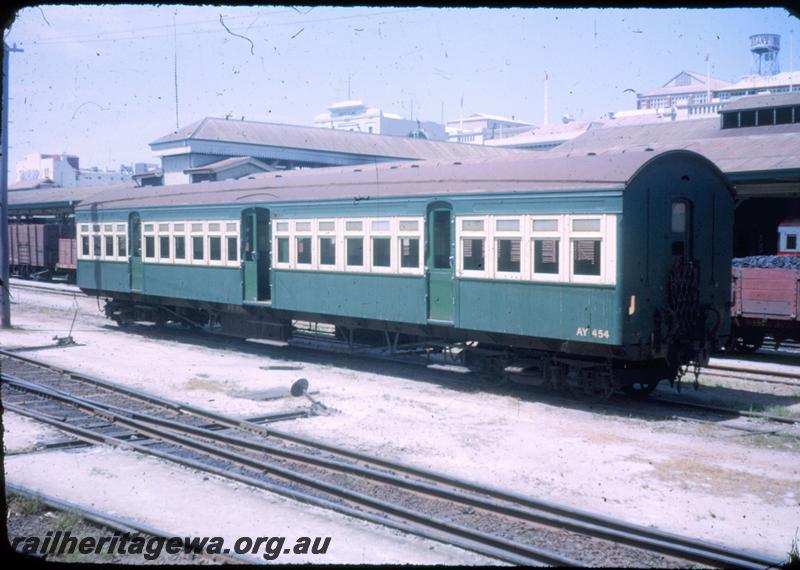 T00051
AY class 454 suburban passenger carriage, green and cream livery, side and end view, Little Davids and cheese knob point levers in yard, Perth Station, ER line
