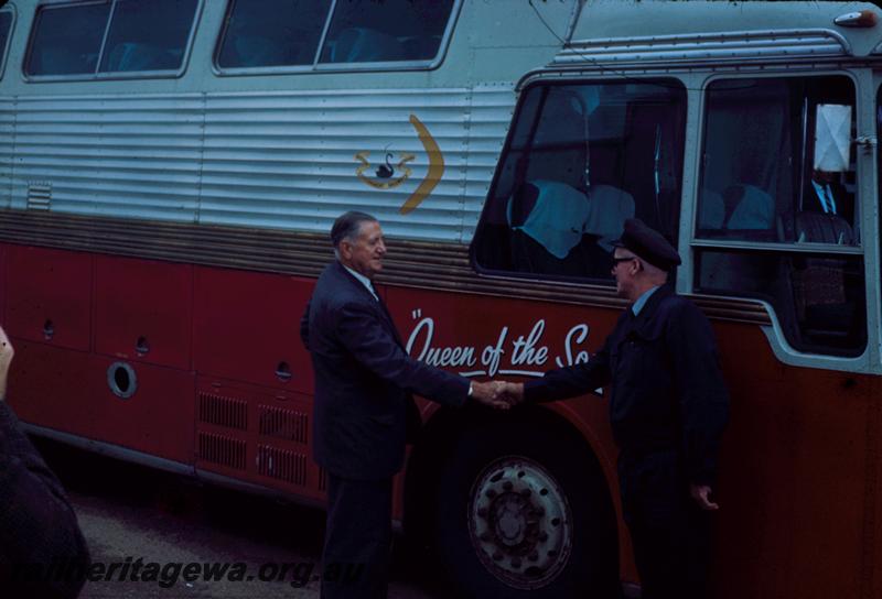 T00166
Commissioner of Railways Mr. C. G. C. Wayne shaking hands with driver of Railway Road Service bus, Guy  